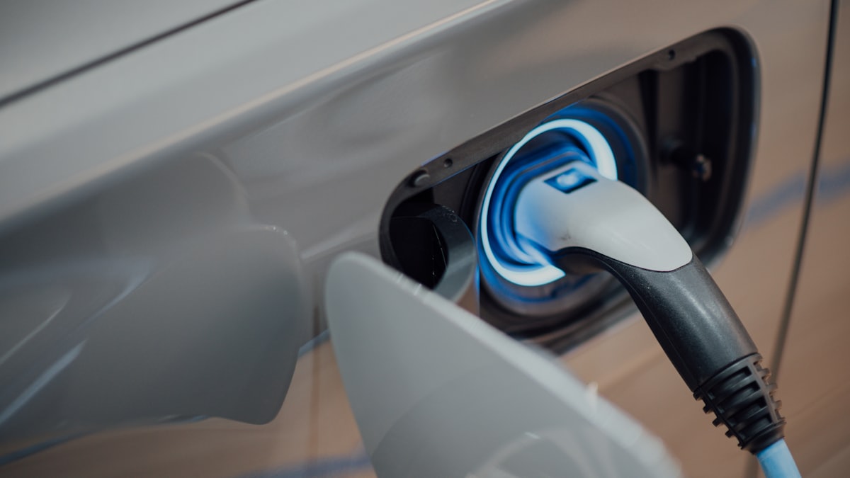 Close-up of an electric vehicle charging at home