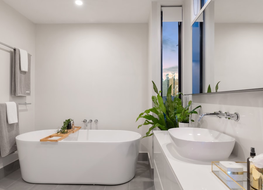 A modern bathroom with a freestanding bath and layered lighting