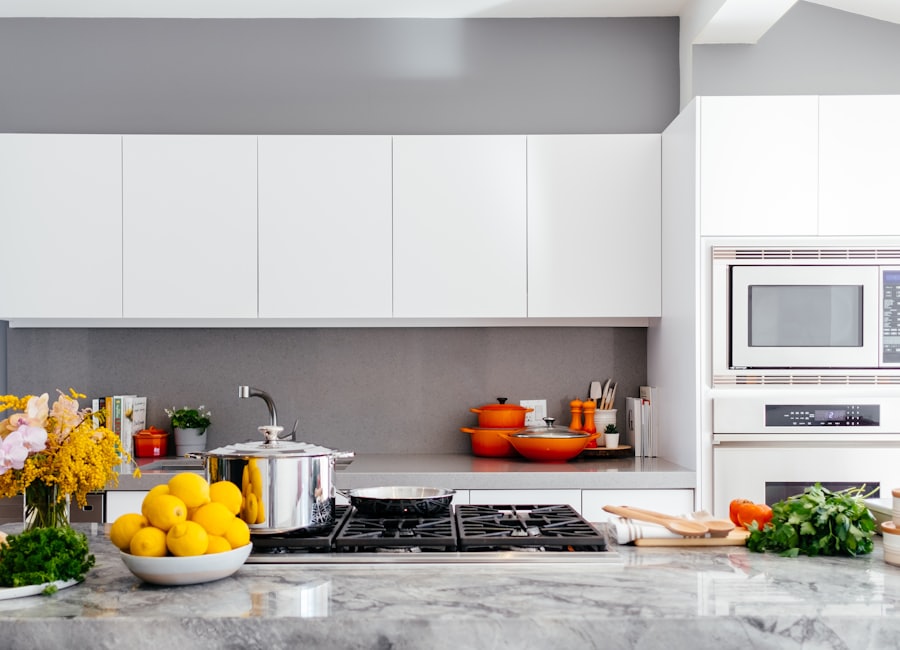 A bright white kitchen with built-in appliances
