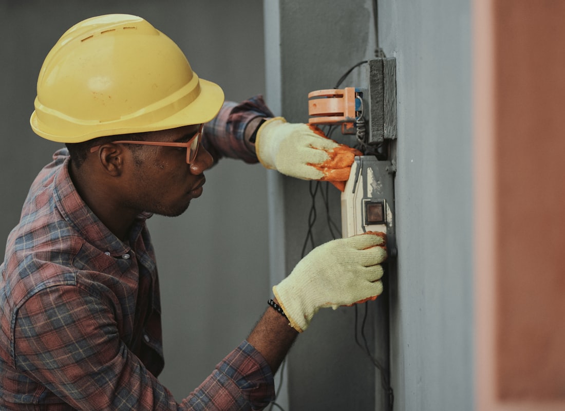 A qualified electrician testing an installation