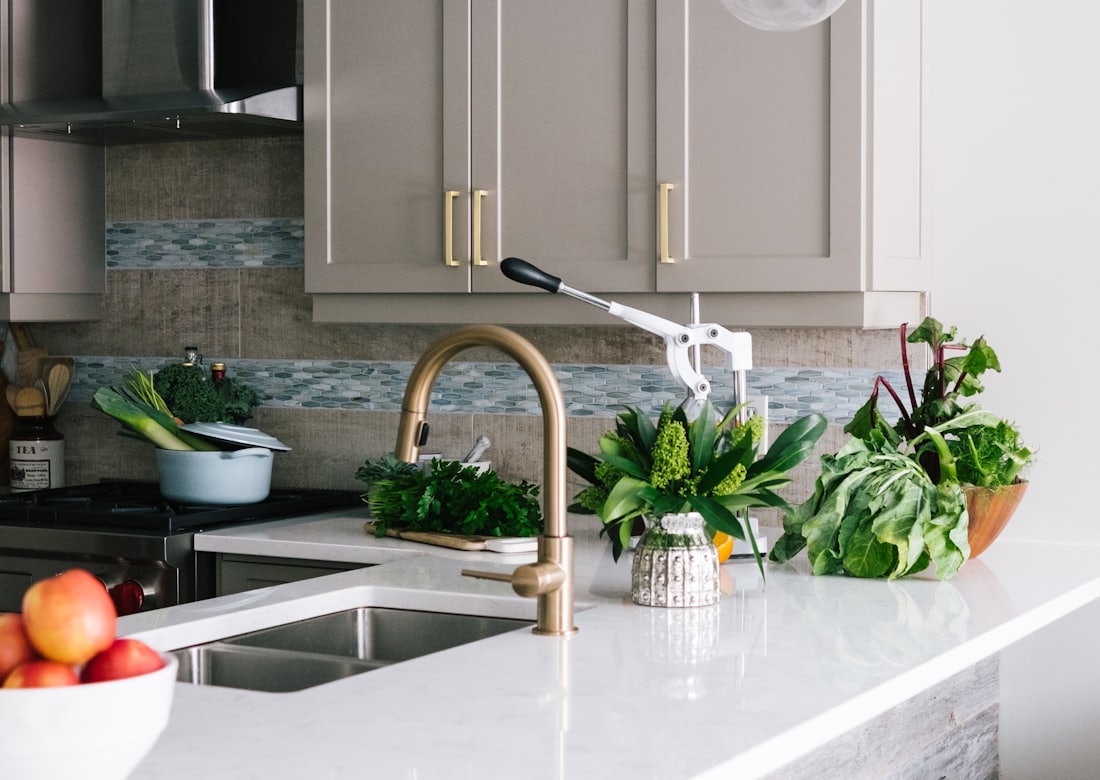 Kitchen room set with glass pendant lights over the island